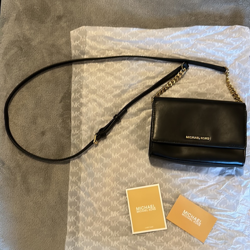 Michael Kors small purse. Black with gold chain accents.